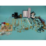 A collection of jewellery to include glass beads, pearls, cameos, silver ingot, silver necklaces,