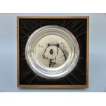 A white metal shallow plate decorated with a panda by Bernard Buffet,