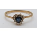 A 9ct gold ring set with a heart shaped sapphire,