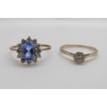 A 9ct gold ring set with a cubic zirconia and a 9ct gold ring set with an oval blue topaz