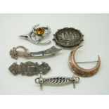 A yellow metal Victorian crescent brooch, a silver and agate knife brooch,