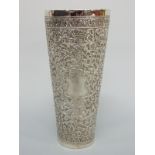 A probably Kutch Indian white metal beaker with embossed decoration and vacant cartouche, 17.
