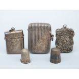 Two hallmarked silver vesta cases, a white metal vesta and two thimbles, one hallmarked silver,