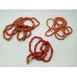 Three coral necklaces.