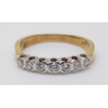 An 18ct gold half eternity ring set with diamonds, 2.