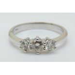 An 18ct white gold ring set with three diamonds totalling approximately 0.