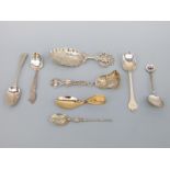 A quantity of hallmarked silver spoons, including a part gilt foliate shovel shaped example,