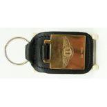 A 9ct gold Bentley key ring with leather fob, B'ham 2004, approximately 12g,