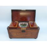 An early 19thC mahogany tea caddy of rectangular form with inlaid ebony detail, raised on bun feet,