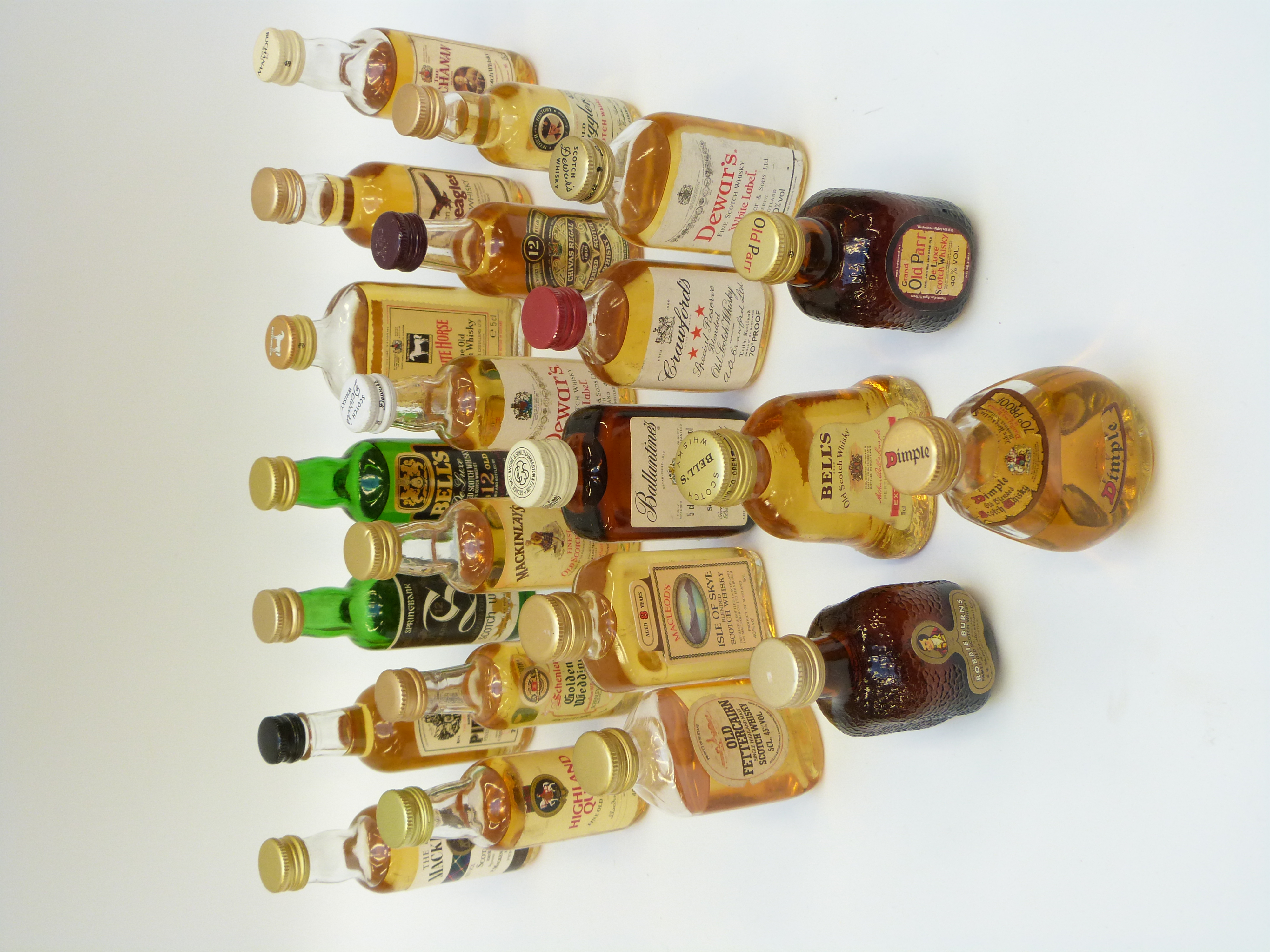 Twenty-two Scotch whisky miniatures including Macleod's 8 year, Dewar's, Dimple,