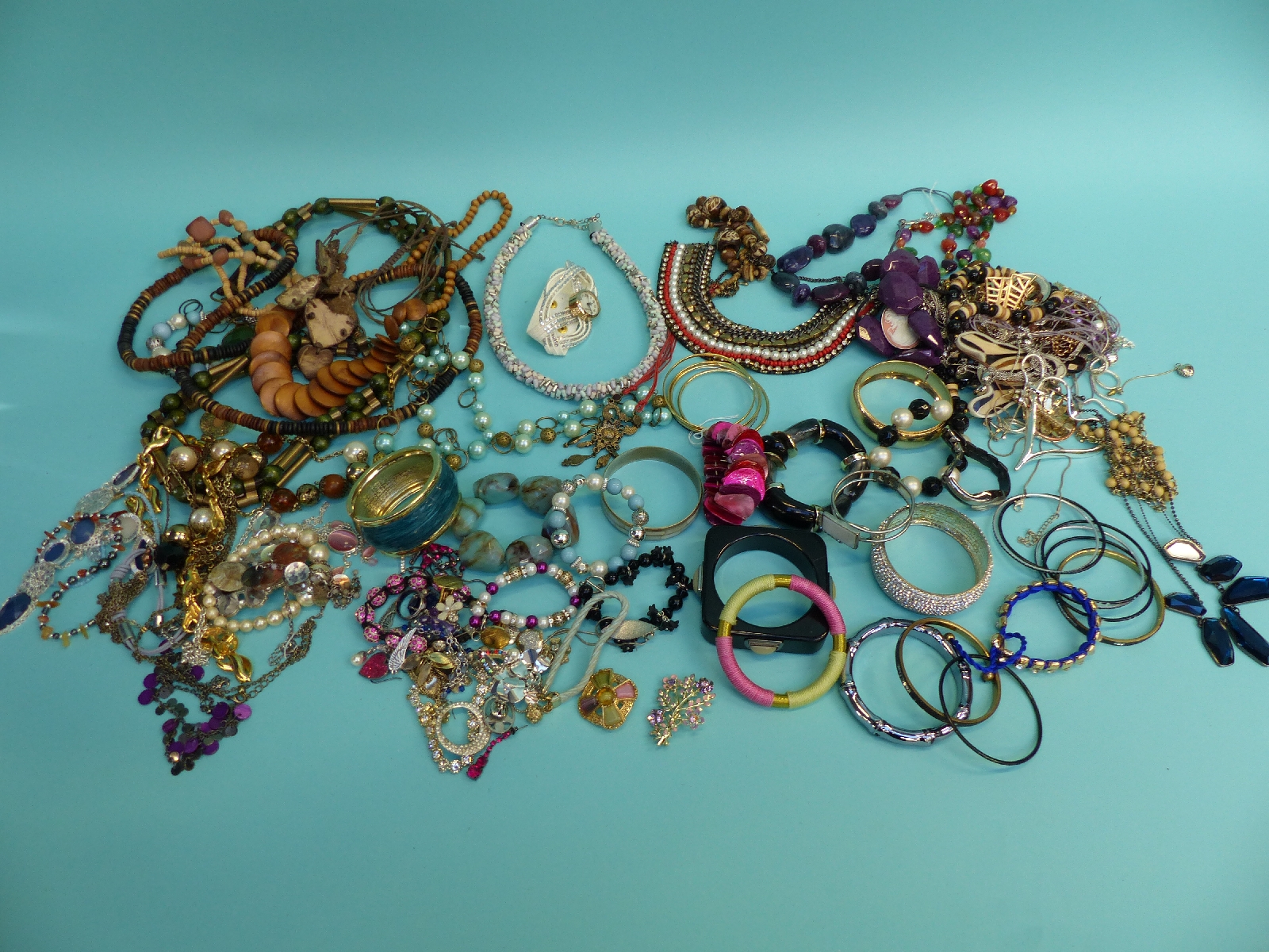 A large quantity of costume jewellery including beads,