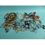 A large quantity of costume jewellery including beads,