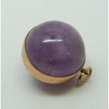 A yellow metal pendant set with amethyst in a sphere, 9.