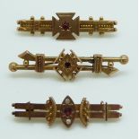 Three late 19th/ early 20thC 9ct gold brooches set with red paste