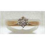 A 9ct gold ring set with diamonds in a cluster, 2.