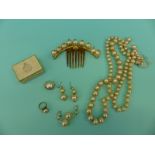 A collection of Edwardian faux pearls including necklace, ring,