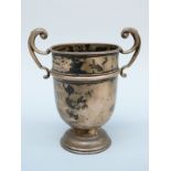 An Edward VII twin handled trophy or similar cup, London 1906 maker's mark rubbed, height 12.