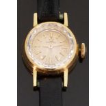 Omega 18ct gold ladies wristwatch with gold hands and baton markers and multi-faceted bezel,