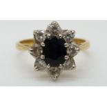 An 18ct gold ring set with an oval sapphire of approximately 0.