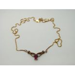 A 9ct gold necklace set with diamonds and synthetic ruby, 5.