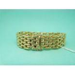 An 18ct gold 'Cartier' style bracelet of polished links,