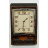 A c1920 LeCoultre Art Deco style travel clock with square Arabic dial and luminous hands,