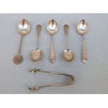 Four hallmarked silver teaspoons and matching tongs, Birmingham 1906 and a collectors' silver spoon,