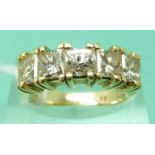 A 14ct gold ring set with five princess cut diamonds each approximately 0.