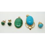 An 18ct gold pendant set with a turquoise cabochon and a 9ct gold pendant set with a malachite