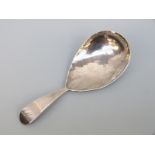 A George IV hallmarked silver tea caddy spoon with hammered decoration, London 1824,