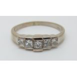 An 18ct white gold ring set with princess cut diamonds, the largest stone approximately 0.18ct, 4.