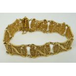 A yellow metal filigree bracelet, 28.