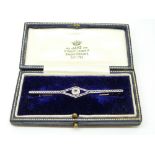 A 15ct gold brooch set with an old cut diamond measuring approximately 0.