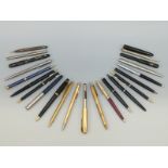 A collection of vintage pens including Burnham, Parker, Eversharp,