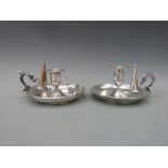 A pair of 19thC plated chambersticks with snuffers,