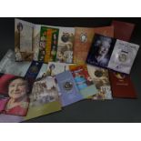 A collection of commemorative £5 crowns in original packs, includes Victoria and Queen Mother,