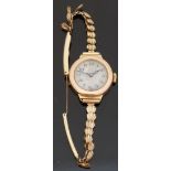 9ct gold ladies wristwatch with Arabic numerals, blued Breguet hands and silvered face,