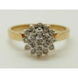 An 18ct gold ring set with diamonds in a cluster, total diamond weight approximately 0.15ct, 3.