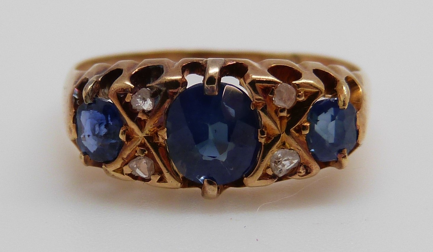 An 18ct gold ring set with three oval cut sapphires and four diamonds (size K/L) - Image 2 of 8