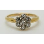 An 18ct white gold ring set with diamonds in a cluster (size L)
