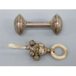 A George V hallmarked silver and mother of pearl baby's rattle, Birmingham 1915 maker's mark rubbed,
