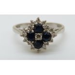 An 18ct white gold ring set with sapphires and diamonds in a cluster (size K)