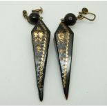 A pair of Victorian tortoiseshell earrings with inlaid gold plated foliate design