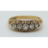 An 18ct gold ring set with five graduated old cut diamonds, 2.
