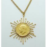 A 1917 gold full sovereign set in pendant mount on a yellow metal chain, 23.