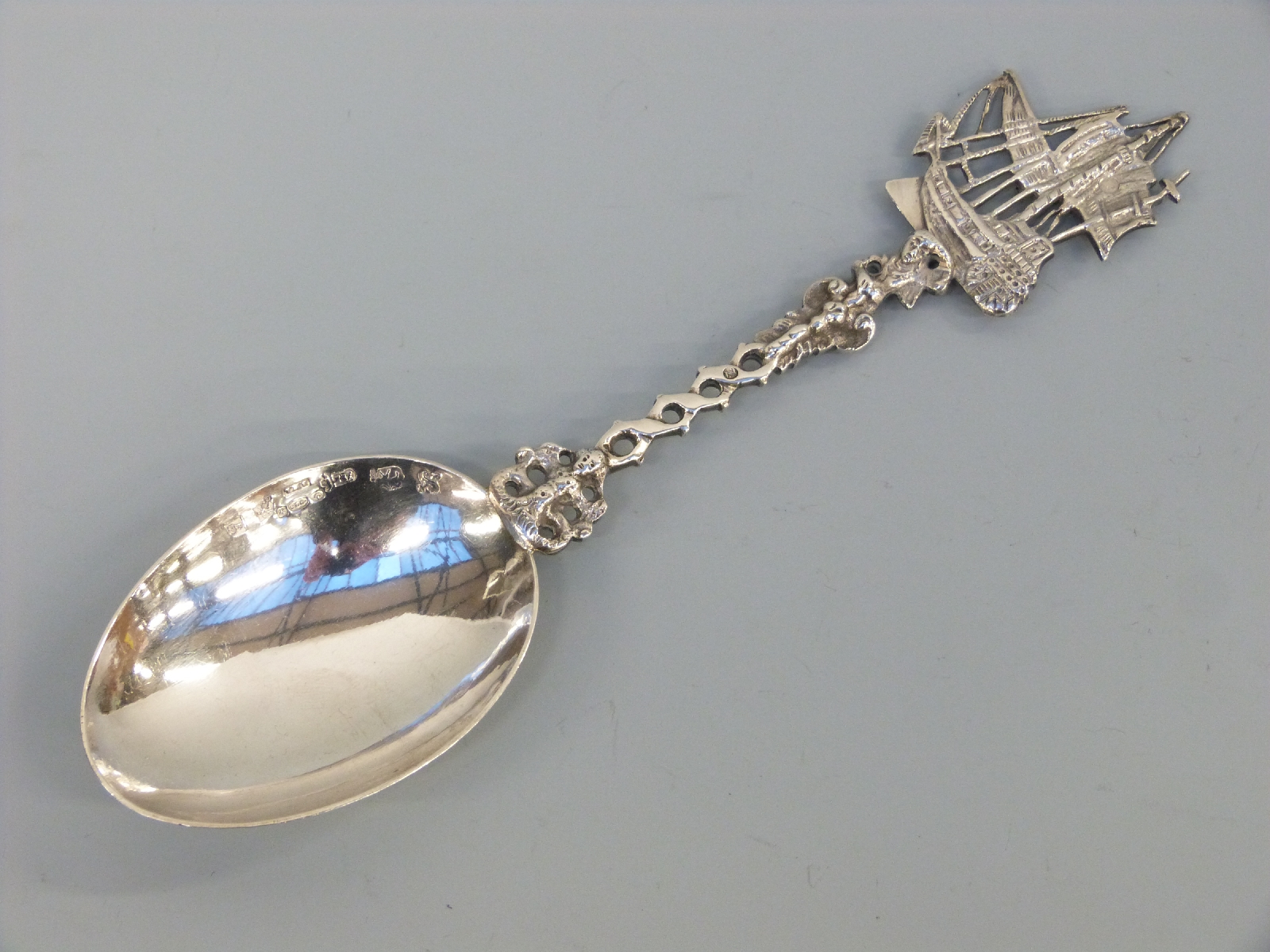 A Dutch hallmarked silver spoon with ship finial and import marks for Chester and Boaz Moses