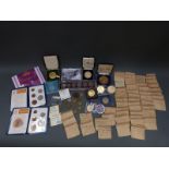 A box of miscellaneous cased coins and some in envelopes.