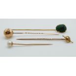 A Victorian stick pin set with a scarab beetle,
