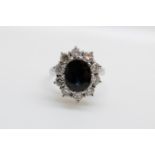 An 18ct white gold ring set with an oval sapphire of approximately 1.