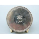 An Italian white metal circular trinket box with engraved coronet and initials to lid,